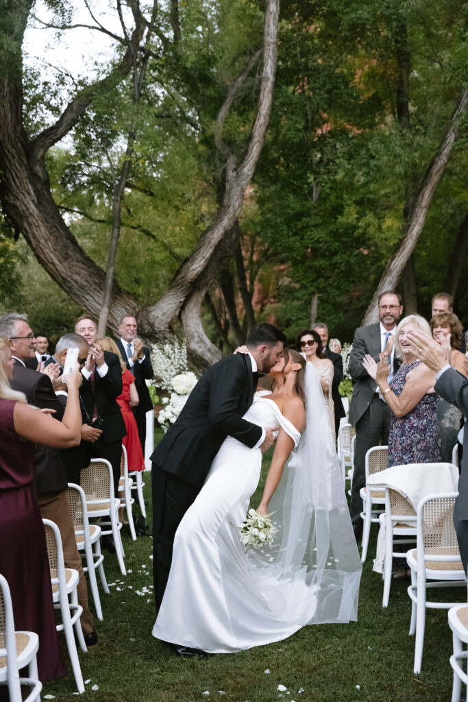 Husband and Wife walk down the aisle after saying "I do!"