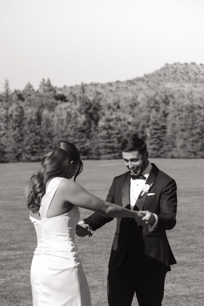 Husband is so happy to see his bride at first look on wedding day