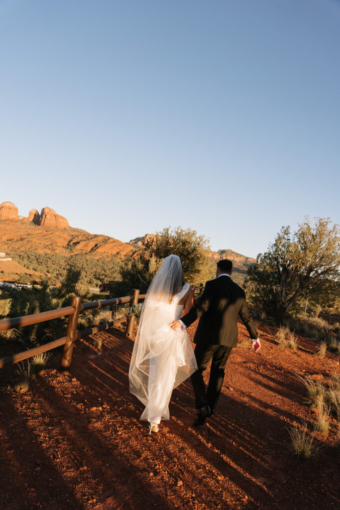 Bride and Groom take golden hour photos in Sedona, Arizona
