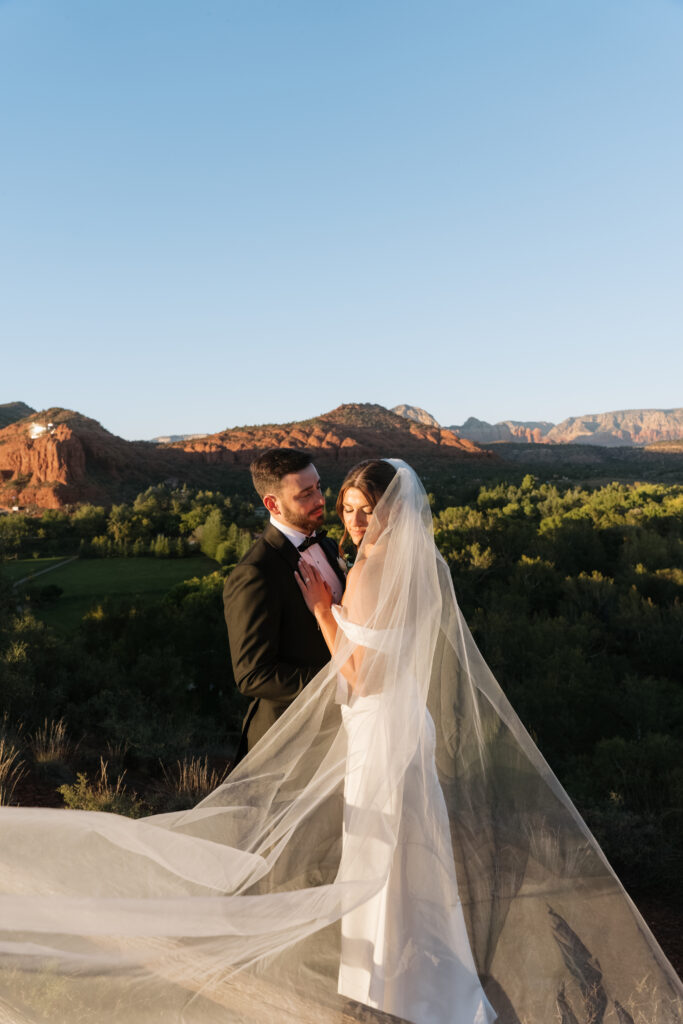 Bride and Groom take golden hour photos in Sedona, Arizona