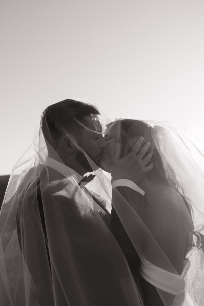 Bride and Groom take golden hour photos in Sedona, Arizona on wedding day