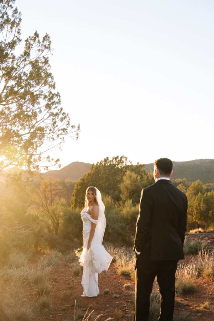 Bride and Groom take golden hour photos in Sedona, Arizona